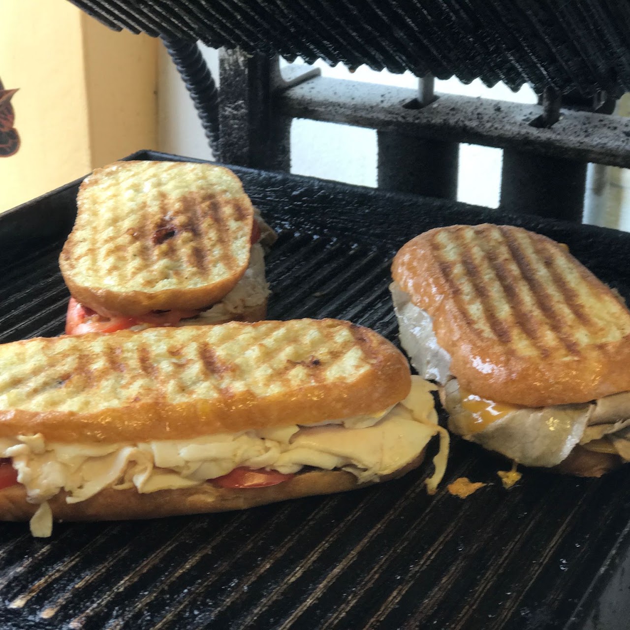 Paninis pressing on the grill